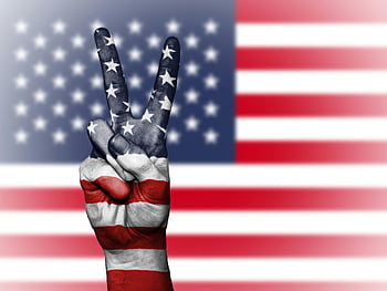 peace hand sign, USA flag, American flag colors, patriotism, blurred US flag, peace sign graphic, hand painted, USA flag backdrop, American patriotism, peace symbol, USA peace sign