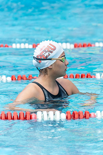 woman swimmer, Peru swim cap, swimming pool, female swimmer, focused swimmer, ready for race, swim competition, swimmer in pool, swim goggles, competitive swimming, swimmer training