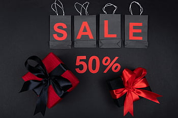 flatlay shot, red and black gifts, sale promotion, black gift boxes, red gift boxes, shopping bags, holiday discounts, stylish sale, 50 percent off, gift packaging, festive gifts