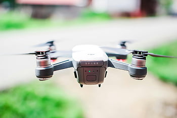 DJI Spark, quadcopter, drone, technology in motion, outdoor setting, front view, flying drone, black spark, DJI, quadcopter drone, motion capture