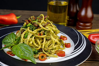 vegan pesto pasta, fresh basil, broccoli, cherry tomatoes, green vegetable, white and black ceramic plate, pasta dish, healthy meal, vegetarian recipe, Italian cuisine, pesto sauce