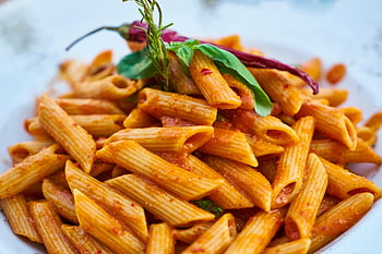 penne pasta, tomato sauce, Italian cuisine, close-up photo, tasty pasta, basil garnish, red chili, pasta dish, penne in sauce, Italian pasta, food photography