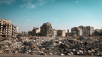 destroyed city street, demolished buildings, rubble, Homs, Syria, post-conflict, urban destruction, war damage, abandoned structures, city ruins, debris