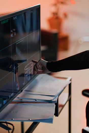 touchscreen, man pointing, modern technology, innovation, hand interaction, digital display, office setting, work environment, professional workspace, touchscreen interface, technology use