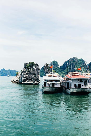 boats, rock formation, Halong Bay, limestone islands, Vietnam, docked boats, peaceful bay, scenic view, water, travel, tourism