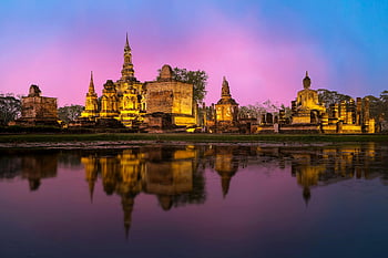 Wat Mahathat, Sukhothai, Thailand, sunset view, temple reflection, surrounding water, beautiful sunset, historical temple, ancient architecture, serene landscape, cultural heritage
