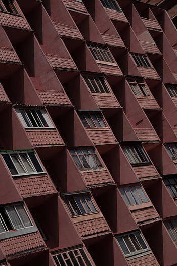 Soviet apartment building, brutalist architecture, Minsk, geometric patterns, unique design, repetition, facade, dynamic shot, urban architecture, Soviet era, building exterior