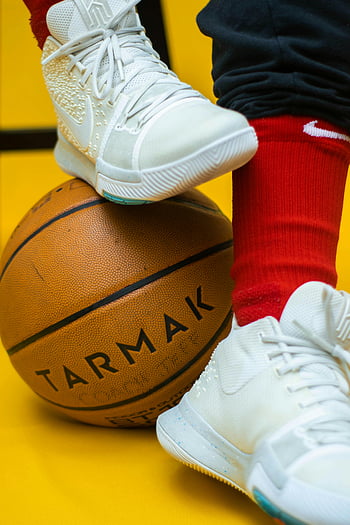 basketball, Tarmak, sporty sneakers, indoor basketball, close-up shot, red socks, white sneakers, foot on basketball, basketball player, indoor sports, yellow background